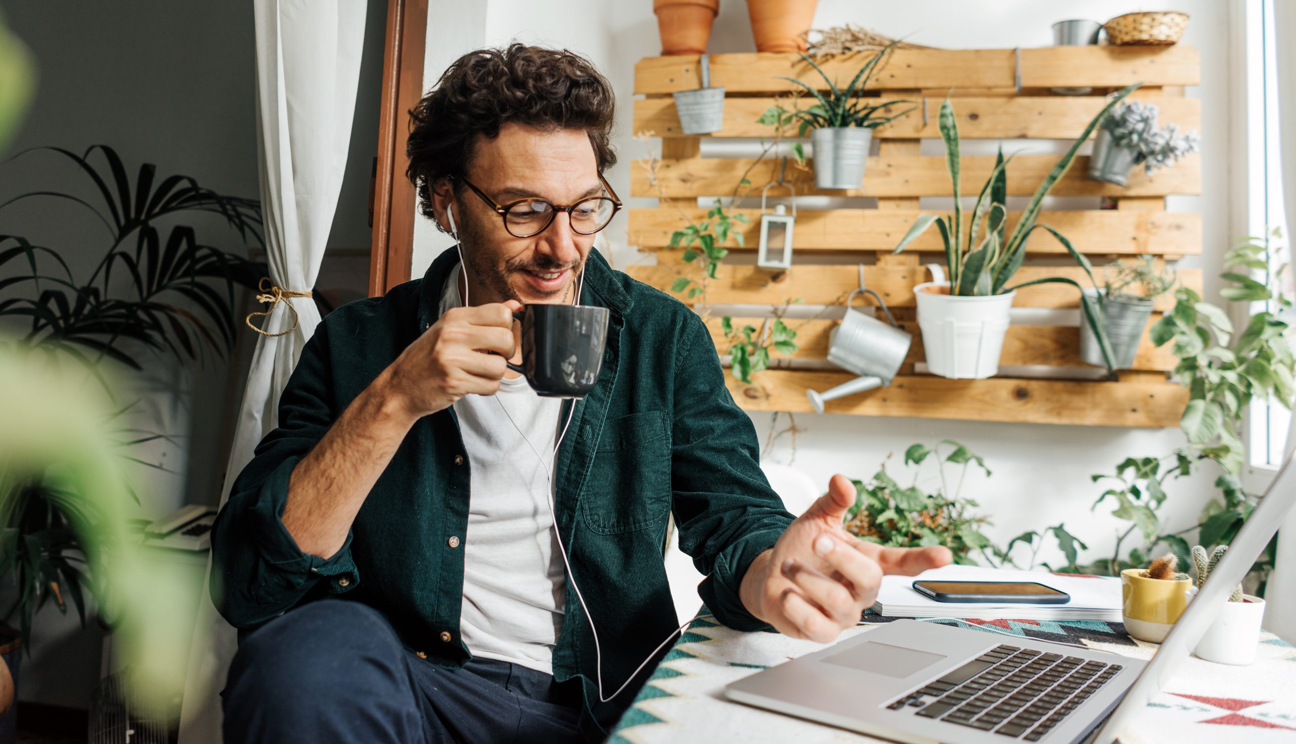 Man working on a laptop from home to support Spotify remote work article