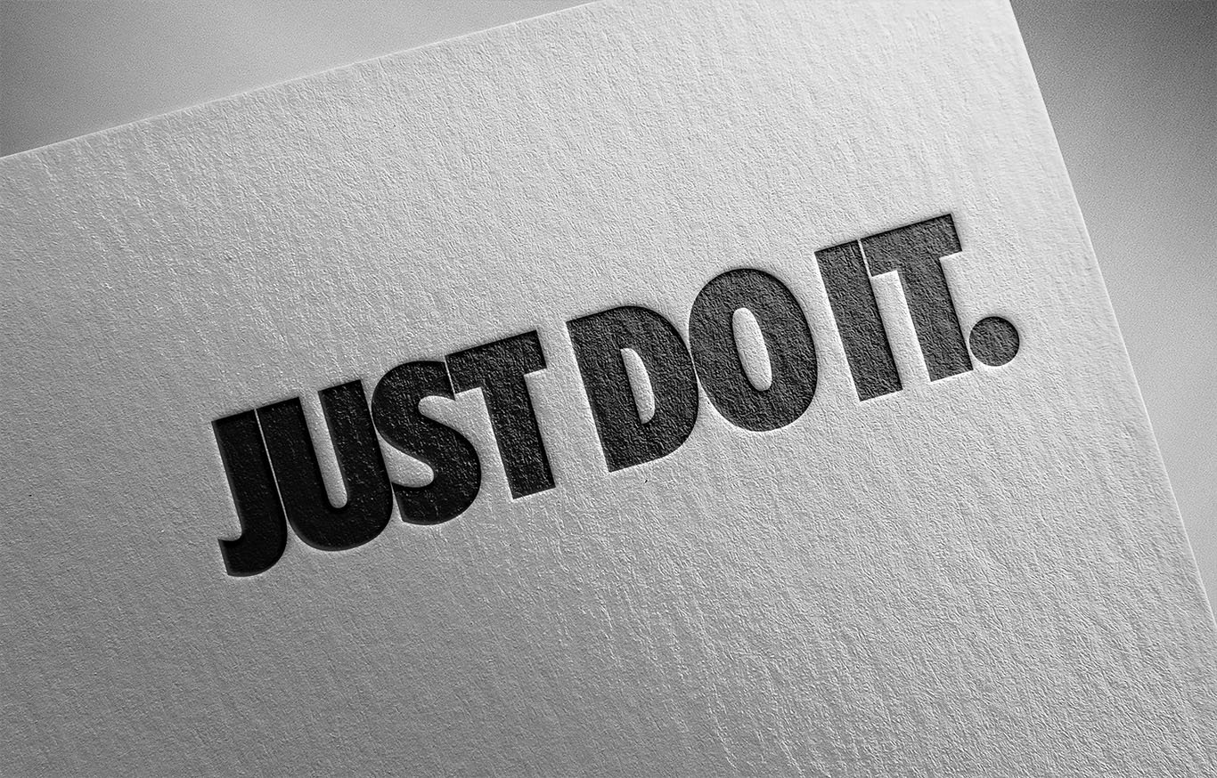 Just Do It Nike slogan on white paper to support Nike leadership article