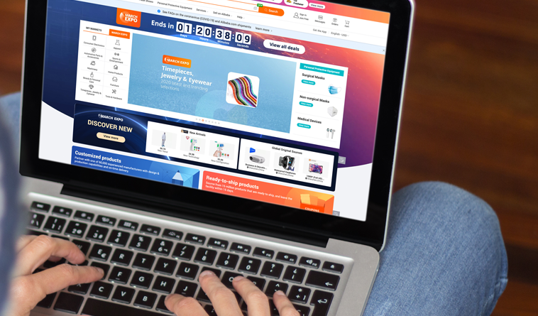 Man browsing the Alibaba website on laptop